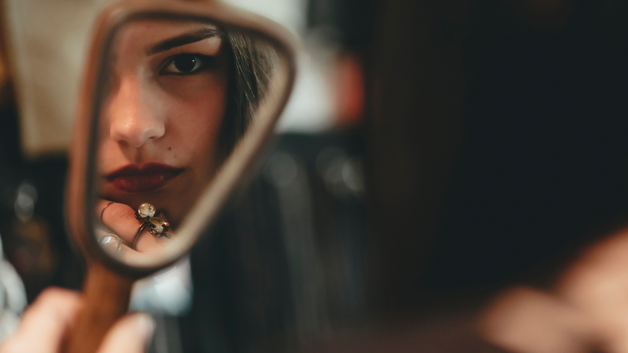 Woman looking in a mirror