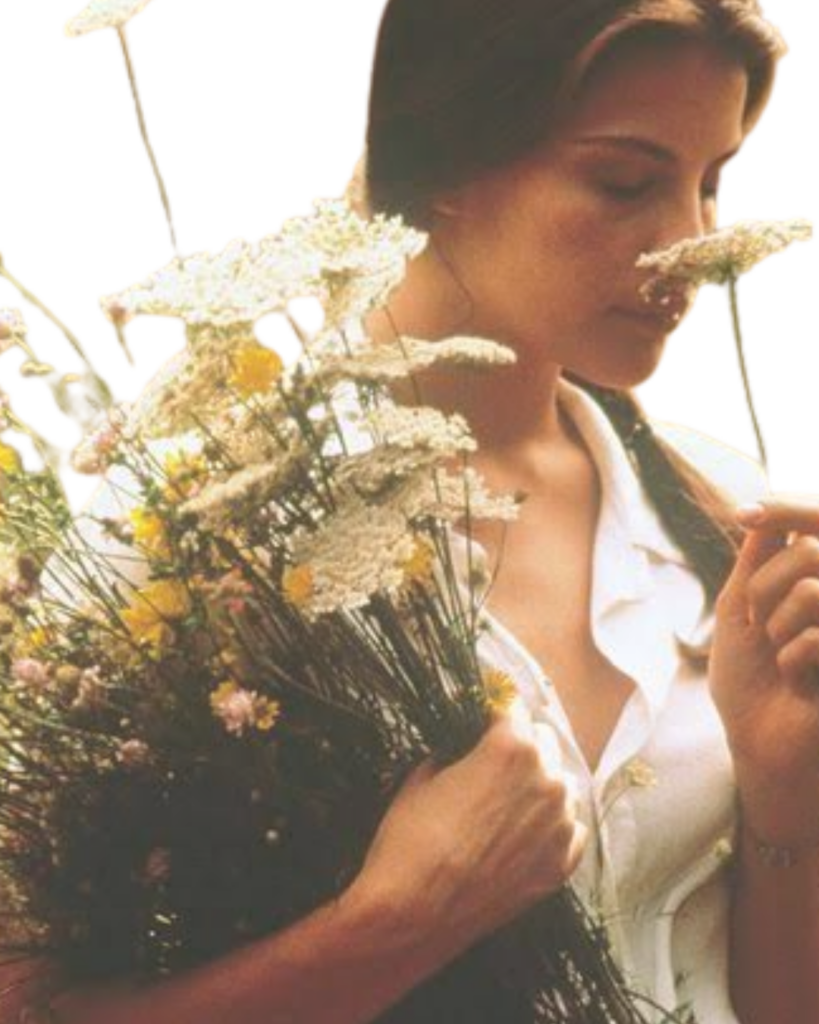 Woman smelling a bouquet of wildflowers
