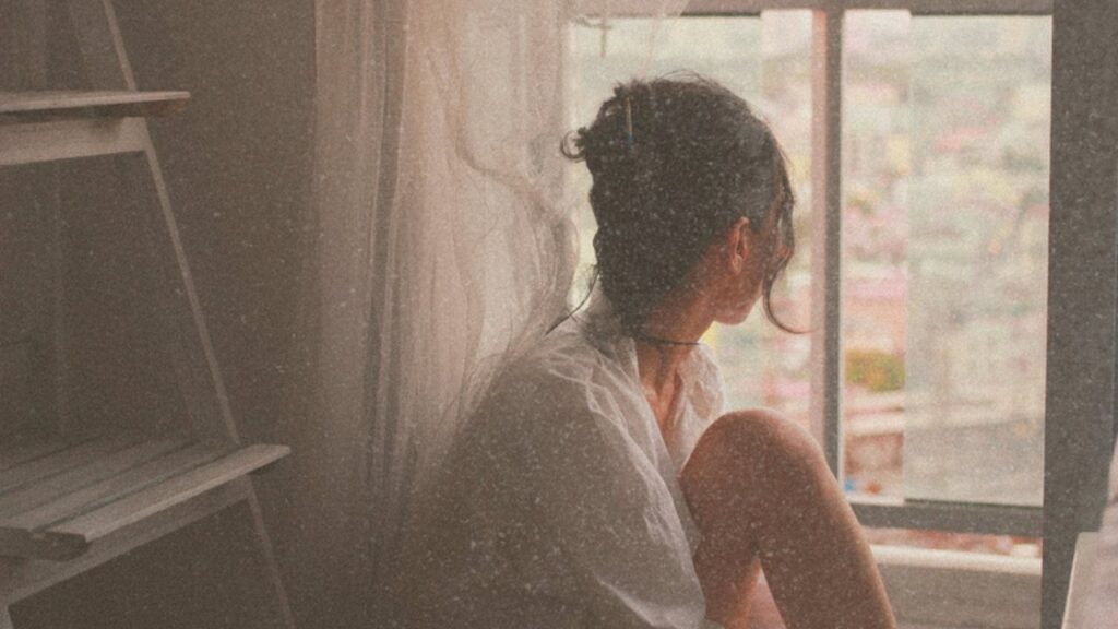Woman looking out the window