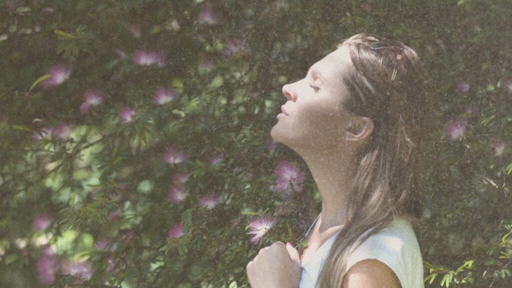 Woman with eyes closed in the sun