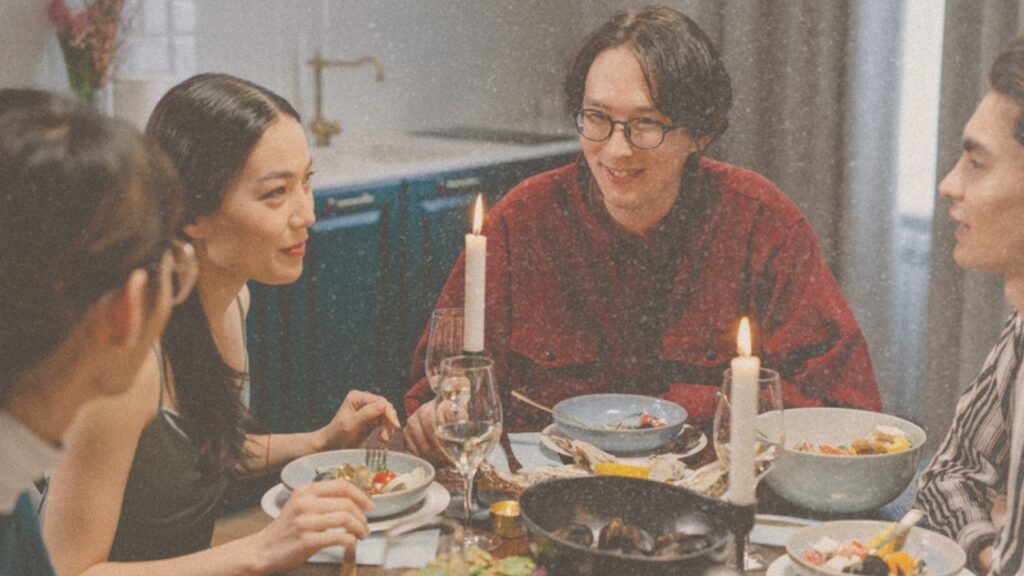 Friends at a candlelit dinner