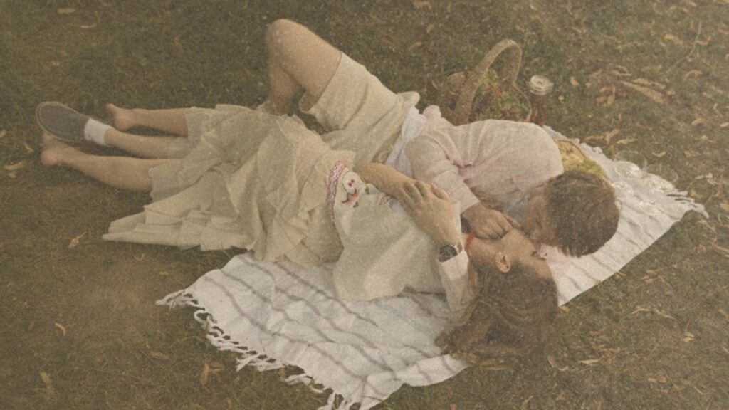 Couple relaxing on a picnic blanket