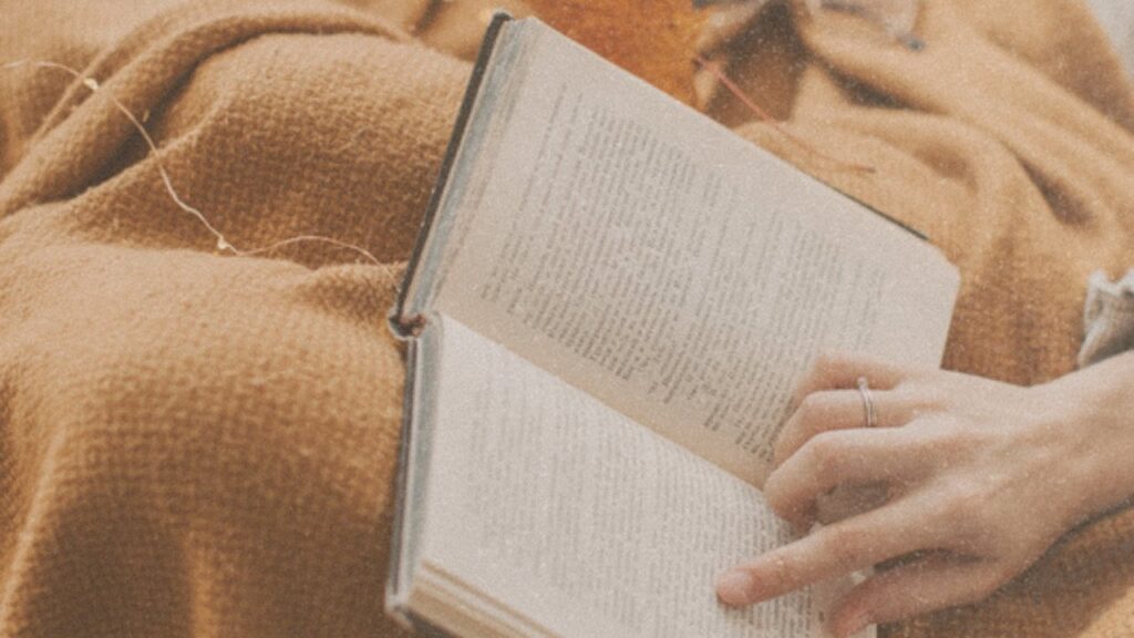 Reading in bed with a blanket and lights