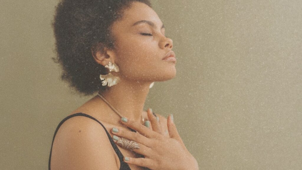 Woman with hand on her chest